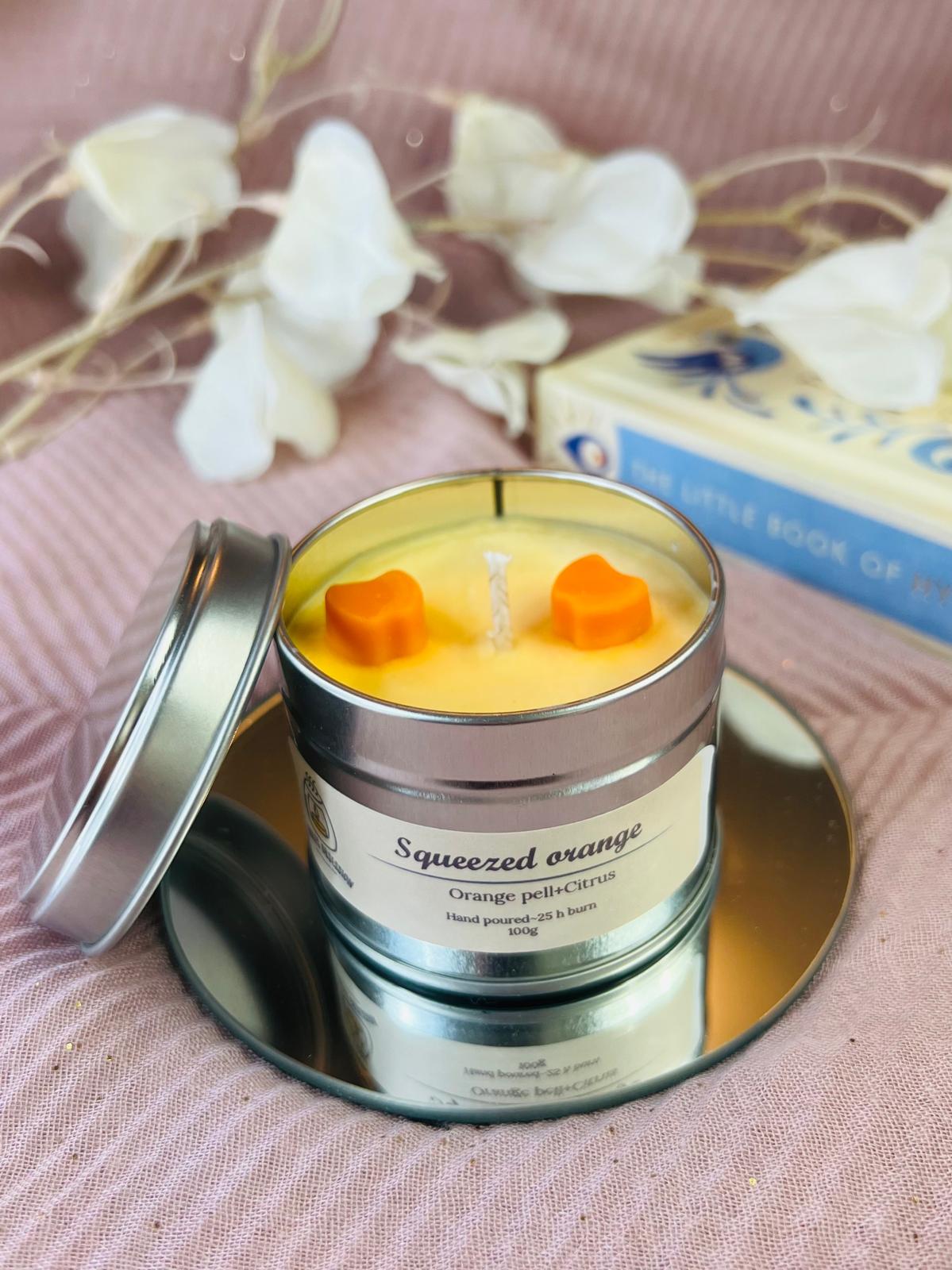 Squeezed orange tin candle